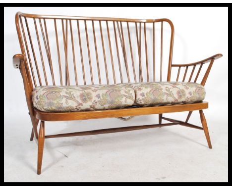 A mid century&nbsp; Ercol ' Windsor ' pattern three seat sofa settee,&nbsp; with tapestry William Morris inspired fabric cush