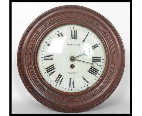 A 19th century French Bulls eye wooden cased Station wall clock, having Roman numeral chapter ring, Nocet Hirt Nantes to the 