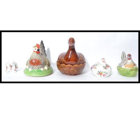 A group of ceramic animals to include a large brown pottery Portmeirion duck tureen, Staffordshire and Crown Devon chicken cr