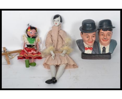 Laurel and Hardy ceramic bust, 1920s style doll with ceramic parts and puppet. Highest measures 55 cm.