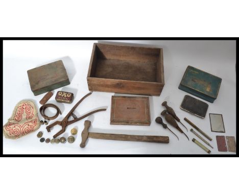 A collection of vintage items dating from the 19th century to include leather working tools various military interest buckles