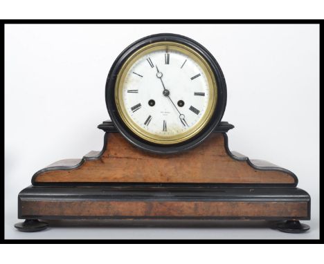 A 19th century Victorian mahogany cased mantel clock, set with an eight day movement, enamel face, roman numeral chapter ring
