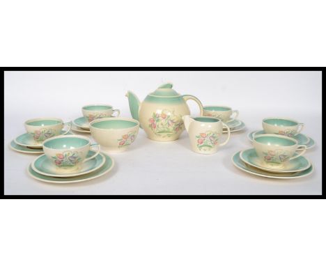 A 1930's Susie Cooper Dresden Spray six person tea service set consisting of six cups saucers and side plate trios, teapot cr