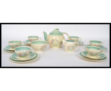 A 1930's Susie Cooper Dresden Spray six person tea service set consisting of six cups saucers and side plate trios, teapot cr