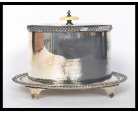 A stunning silver plated bacon warmer bearing marks for Walker and Hall to the base, raised on four feet with a hinged lid su