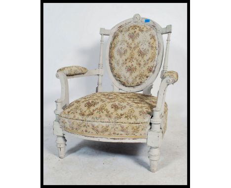 A 19th century French fauteuil armchair recently being up - cycled with a shabby chic finish and raised on turned legs with c