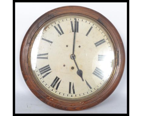A 19th century Victorian oak cased wall mounted station / school&nbsp; clock having a white enamel face with Roman numeral ch