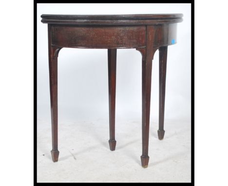 An early 20th century Georgian style mahogany demi - lune side table / card table, flip over top lined with green baize, rais