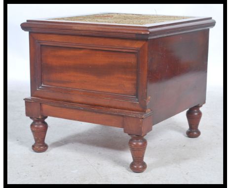 A Victorian mahogany step commode being raised on turned legs with pull out step, hinged carpet lined top with ceramic liner 