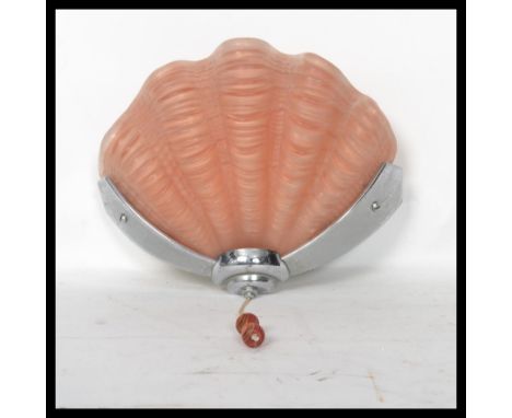 A mid 20th century Art Deco Odeon style frosted glass shell&nbsp; shaped porch wall light lamp being set within a chrome fram