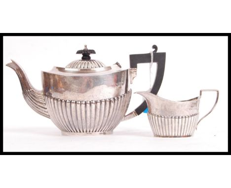 A part silver hallmarked tea service to include teapot and creamer, Birmingham assay marks, makers marks for&nbsp;William Dev