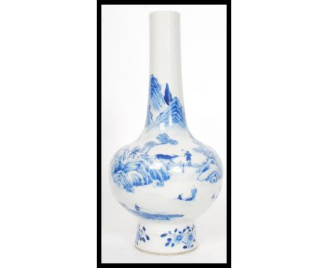 A Kangxi ( Kang Xi ) Chinese blue and white vase of mallet / onion form. The vase raised on a circular ribbed foot decorated 