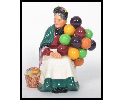 A vintage 20th century Royal Doulton ' The Old Balloon Seller ' HN1315 ceramic figurine, 20cm high with early Royal Doulton s