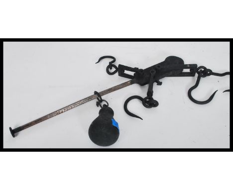 A pair of 19th century ebonised hand held cast metal / iron sack scales, no visible makers name obvious.