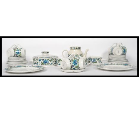 A 20thj century retro part dinner and tea service by Midwinter consisting of teapot, cups, plates, tureens etc please refer t