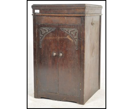 An Edwardian mahogany box pedestal gramaphone cabinet of upright form with hinged top opening to reveal the record player dec