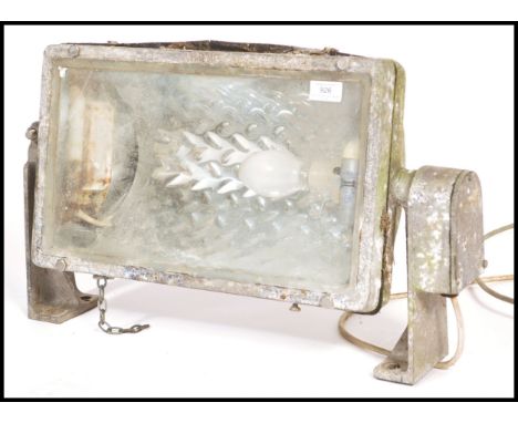 A vintage retro 20th century adjustable Industrial wall mounted factory / street lamp having a rectangular glass panel with g