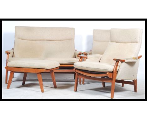 A retro 20th century Danish inspired three piece suite consisting of two armchairs and a matching two seater sofa / settee. R