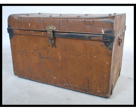 An early 20th century vintage grained tin / tack trunk with lock to front with fitted hinged top