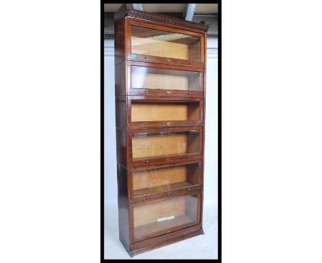 An Edwardian Indutrial Lebus mahogany 6 section - stack lawyers stacking bookcase cabinet. The shaped base with 6 glass cabin