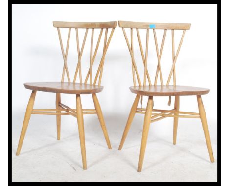 A pair of fantastic vintage&nbsp; mid 20th Century Ercol Windsor beech and elm cross back candlestick dining chairs, solid se