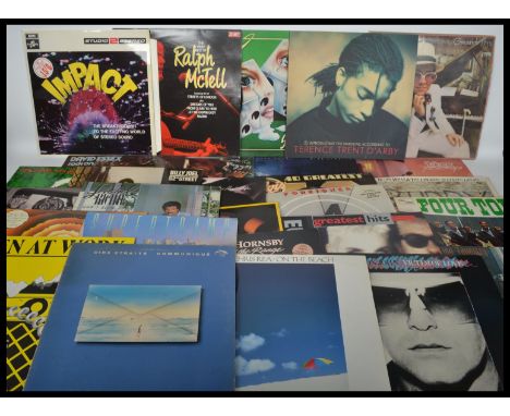 Vinyl Records - A good collection of vinyl long play LP records featuring various artists and genres to include 10CC, Four To