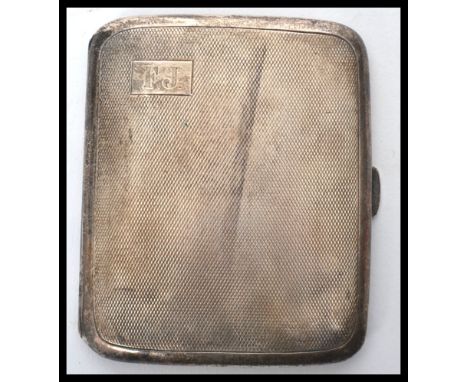An early 20th century 1920's silver hallmarked cigarette case having an engine turned design. Hallmarked for Birmingham 1929 