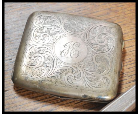 A collection of silver  items to include a silver hallmarked cigarette case, a dressing table mirror with tortoiseshell back 