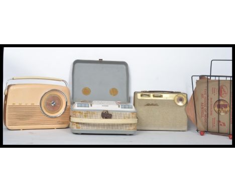 A vintage reel to reel player together with vintage radios, record rack etc.