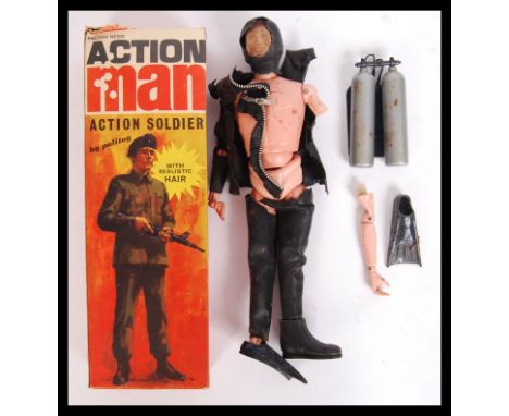 A vintage Palitoy made Action Man 'diver' figure with oxygen tanks. Damage to figure. Within the original box. AF.&nbsp;