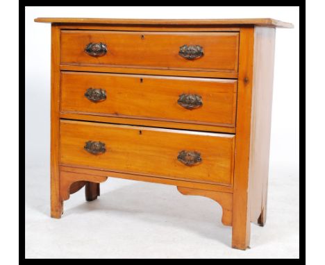 An early 20th century Edwardian walnut straight three cottage chest of drawers, drop handles raised on bracket feet.&nbsp;Mea