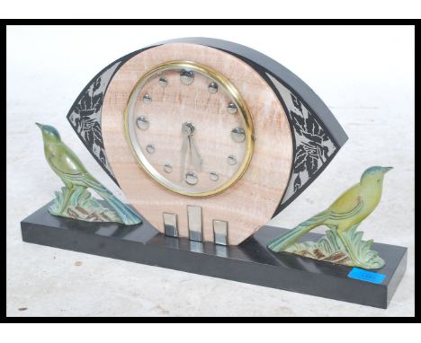 An early 20th century 1930's&nbsp; Art Deco Verdigris mantel clock raised on a marble base with painted spelter figurines of 