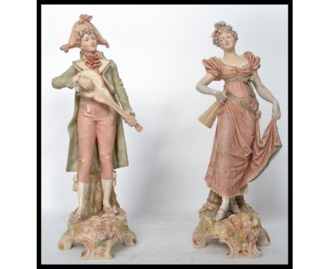 A pair of Royal Dux ceramic figures modelled as a lady and gent. Pink Royal Dux triangles to base. Impressed 117 and 118 mark
