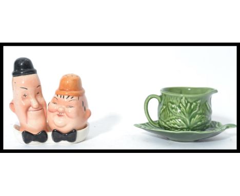 A vintage 20th century novelty Beswick Laurel and Hardy salt and pepper cruet set together with a Sylvac sauce boat with matc