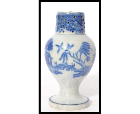 A 19th century blue and white ceramic sander pounce pot having a circular vase with bulbous body and pierced neck and top. De