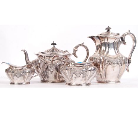 An Edwardian matching four piece silver plated tea service, consisting of teapot, water pot, sugar pot and creamer,  stamped 