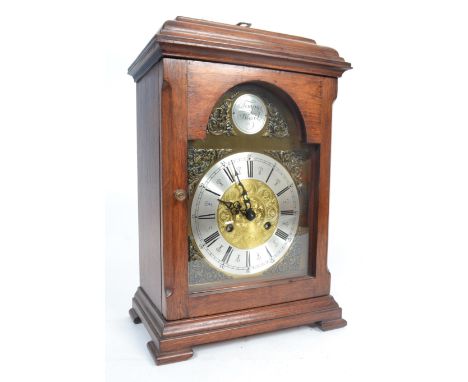 A 20th century Antique style mahogany cased Tempus Fugit bracket clock. Set in a mahogany case,&nbsp; the brass and silvered 