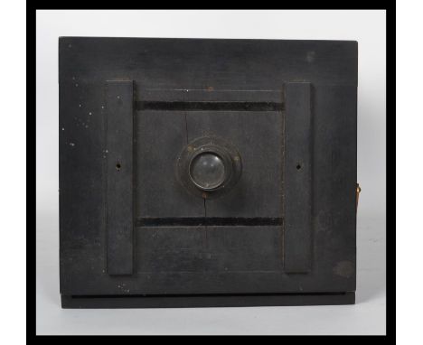 A believed 19th century metamorphic folding plate pinhole camera with extras such as a spare brass lens etc. Measures 45 cm d