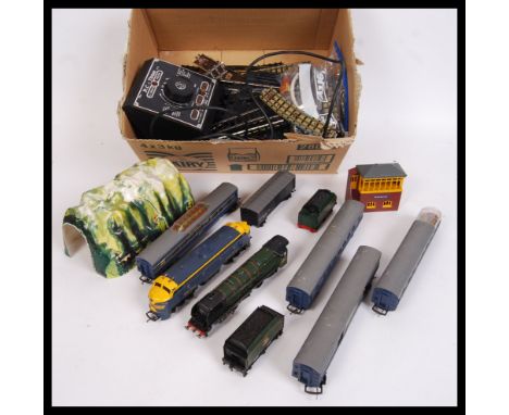 A collection of vintage assorted Triang Railways items to include; small station, curved &amp; straight tracks, tunnel, locom