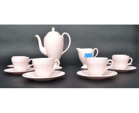 A Wedgwood ceramic tea service in the Alpine Pink pattern consisting of cups saucers tea pot creamer jug sugar bowl etc.