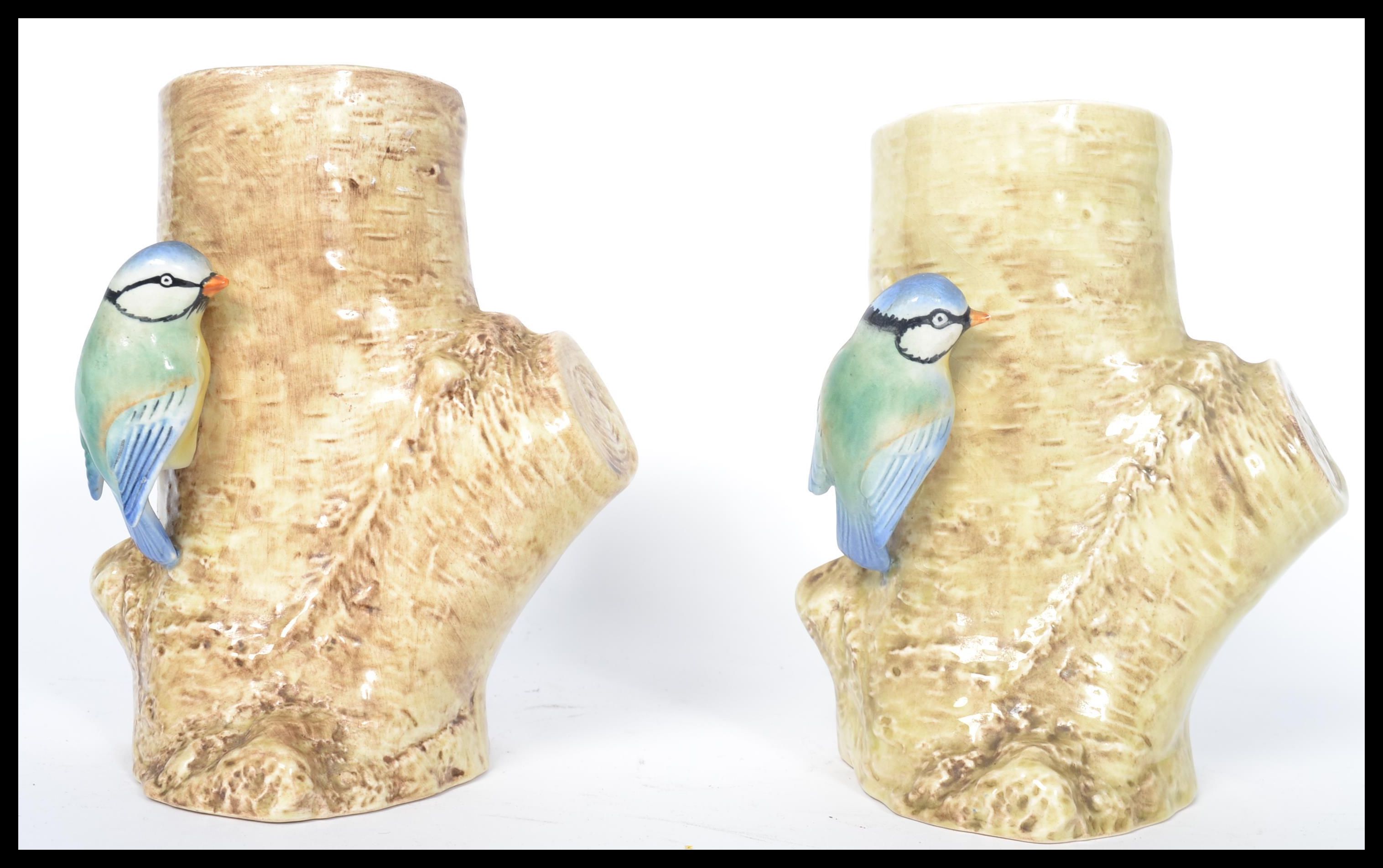 A Pair Of Sylvac Pottery Vases Modelled With Blue Tits Perched On