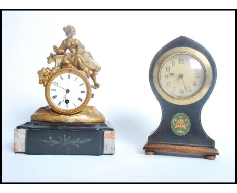 Two clock one being an early 20th century Edwardian mahogany balloon clock having an ebonised front and painted green cartouc