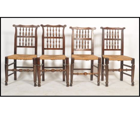 A good set of North Country ladderback country oak dining chairs being raised turned legs with rattan seats having bobbin tur