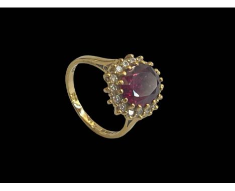 Ruby and diamond 18 carat gold ring, size P.