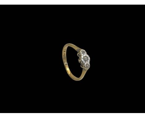 18 carat yellow gold and platinum set three stone diamond ring, size K.