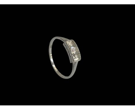 Diamond three stone platinum ring, size O.