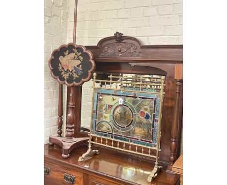 Edwardian brass and stained glass firescreen and Victorian mahogany pole screen on inverted triform base (2).