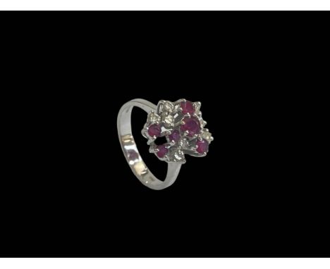 Ruby and diamond 18 carat white gold cluster ring, size O/P.