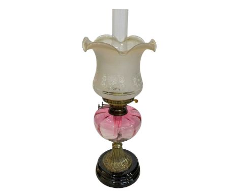 Victorian ruby glass reservoir oil lamp with etched shade.