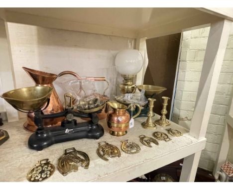 Polished copper and brass bound jug, oil lamp, scales with weights, horse brasses, etc.